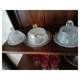 3 round butter dishes with lids.