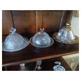 3 round butter dishes with lids.