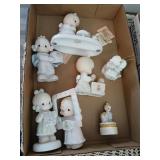 7 precious moment figures.