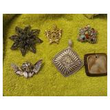 6 pendants one of them is a pin