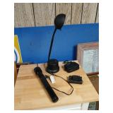 Desk, lamp, flashlight and binoculars.