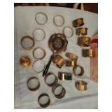 Box of silver napkin rings and strainer.