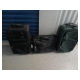 Two suitcases and a briefcase