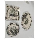 3 black and white decorator plates.