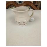 Longaburger pottery pitcher red.