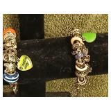 2 Pandora style bracelets with charms.