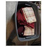Plastic bin full of sheets multiple colors