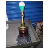 Red glass ship style lamp.