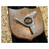Chevrolet 3-Bar Spinner Wheel Center Cap on wood