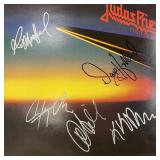 Judas Priest Point of Entry signed album. GFA...
