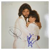 Barbra Streisand Guilty signed album. GFA...