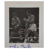 Muhammad Ali and Leon Spinks signed photo. GFA...