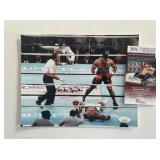 Michael Spinks signed photo. JSA