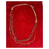 Necklace with a gold chain and beads