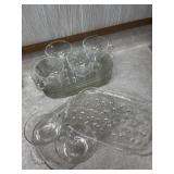 assorted collection of glass tea cups and trays