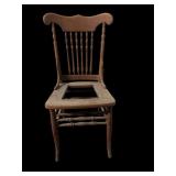 antique pressed-back oak chair