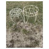 A pair of metal plant stands