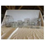 Assorted clear canning jars with lids