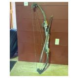 camo compound bow with arrows