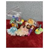 Some dolls, McDonald toys and a bag of action
