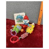 A baby plastic animal book daddy Smurf, two