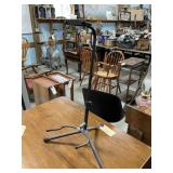 black, adjustable tripod stand