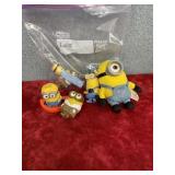 Six figurines of minions and a PEZ candy holder