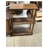 three-tiered wooden shelf