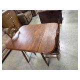 wooden drop leaf table and ladder-back chairs