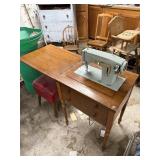 Sears Kenmore Sewing Machine with red chair