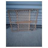 Plastic and wooden baby gate