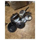 assorted frying pans,pots,and sauce pans