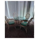 Benchcraft rattan glass top table w/ four chairs