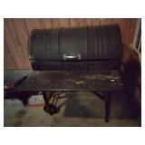 Rolling barrel charcoal grill