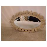 Metal seashell framed oval mirror
