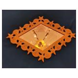 Metal seashell framed diamond shaped mirror