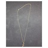 10ks Music note necklace .50g