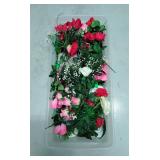 Tote of assorted artificial flowers