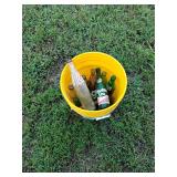 Bucket of vintage glass bottles