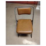 Folding cushioned chair