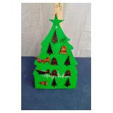 Christmas pins on display stand