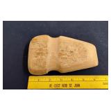 Carved stone axe