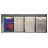 Lot of four misc zippo lighters
