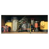 Shelf lot of misc flashlights radio jar and more