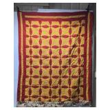 82" by 68" red and yellow quilt