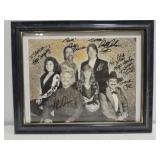 Framed autographed group picture Framed autographed group picture