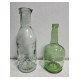 1 vintage milk bottle and 1 green glass bottle 1 vintage milk bottle and 1 green glass bottle
