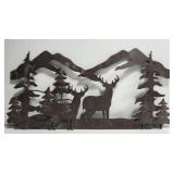 Metal decor of deer and pines