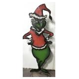 Metal Grinch in Santa suit yard decor