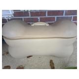 Dog bone shaped storage box with toys